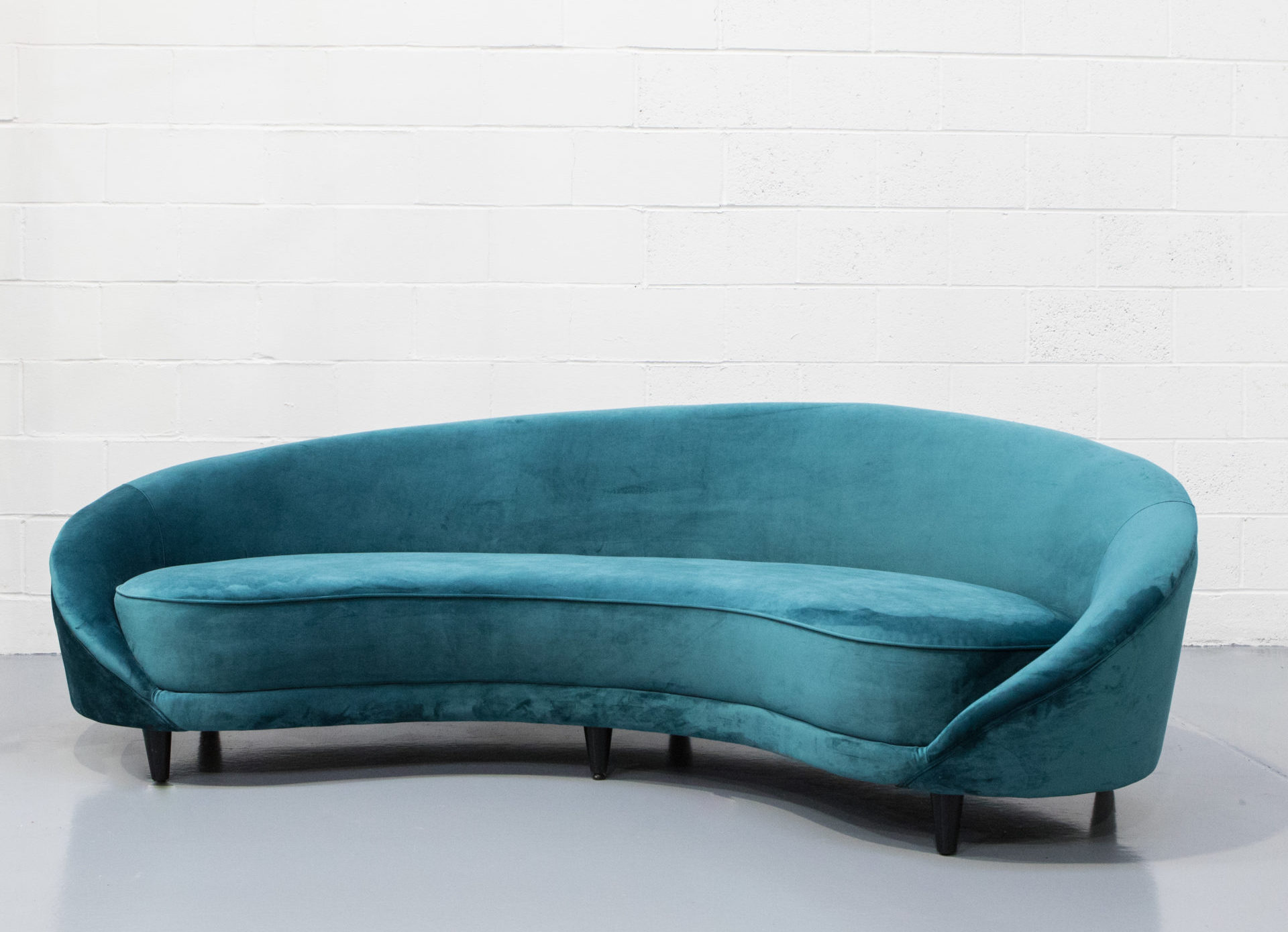 Event furniture hire - Blue velvet curved sofa available for hire in London