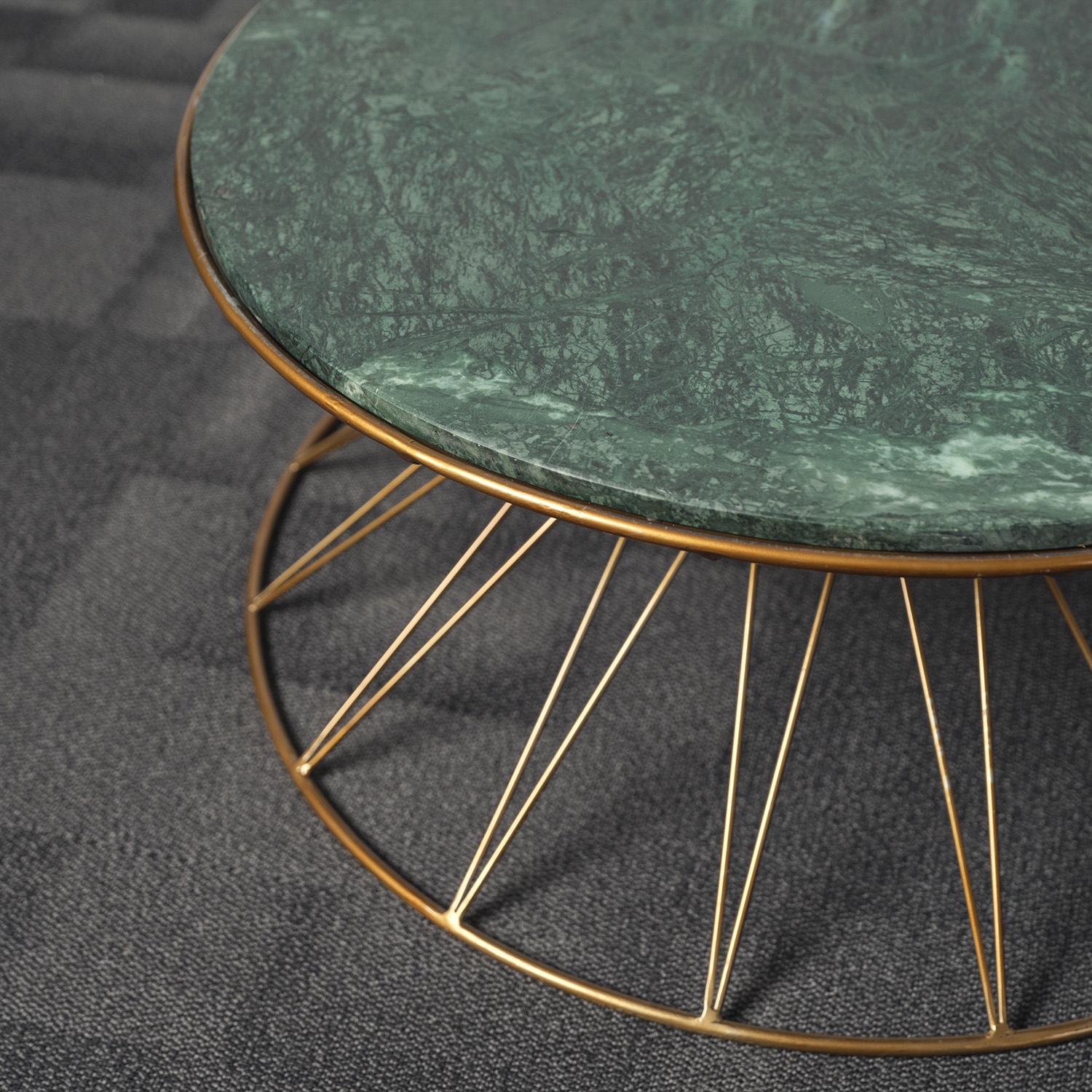 Round, side table with a green marble top and woven brass frame
